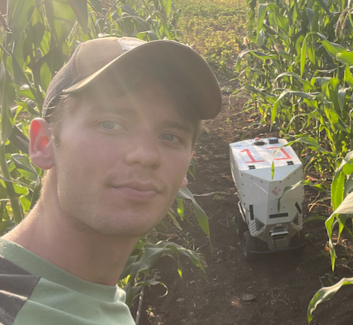 Picture of me with a robot at a corn field in India!